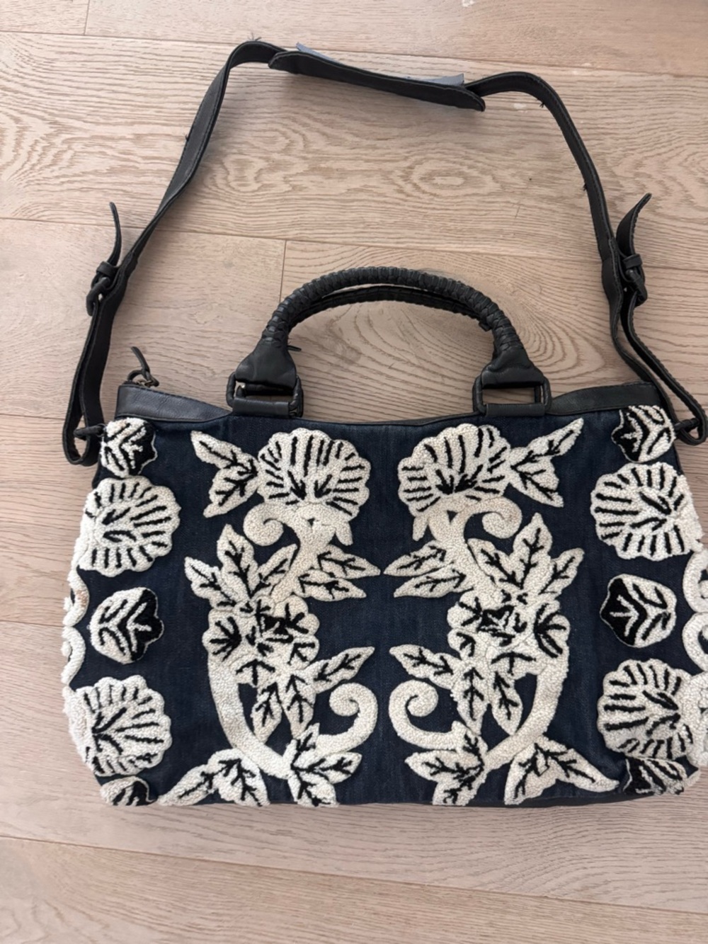 Cleobella Asliah Weekender bag featuring embroidered floral details on the front